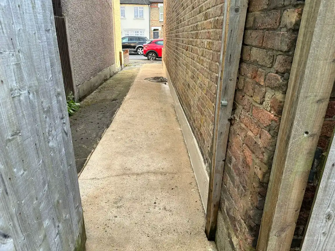 Narrow paved passage between walls