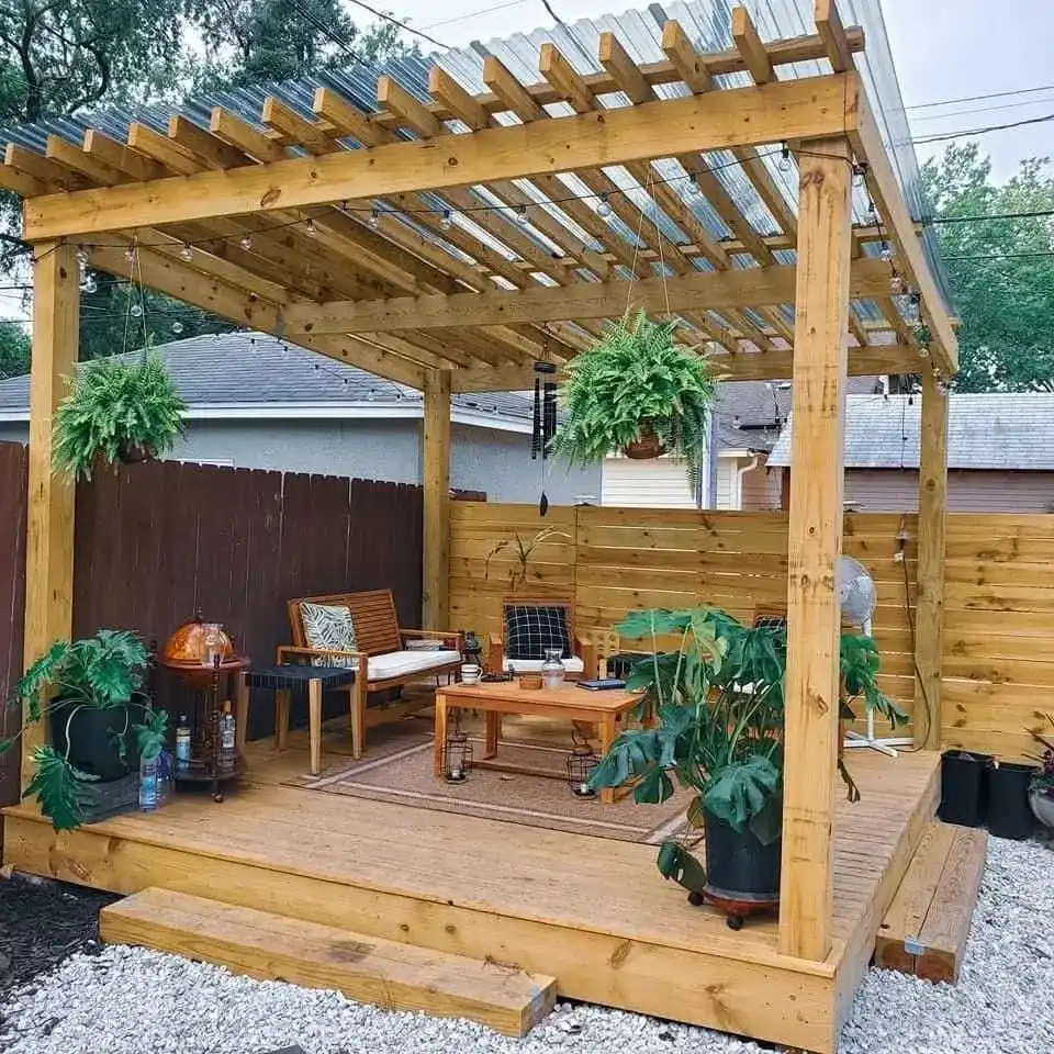 Timber garden shelter with a seating area