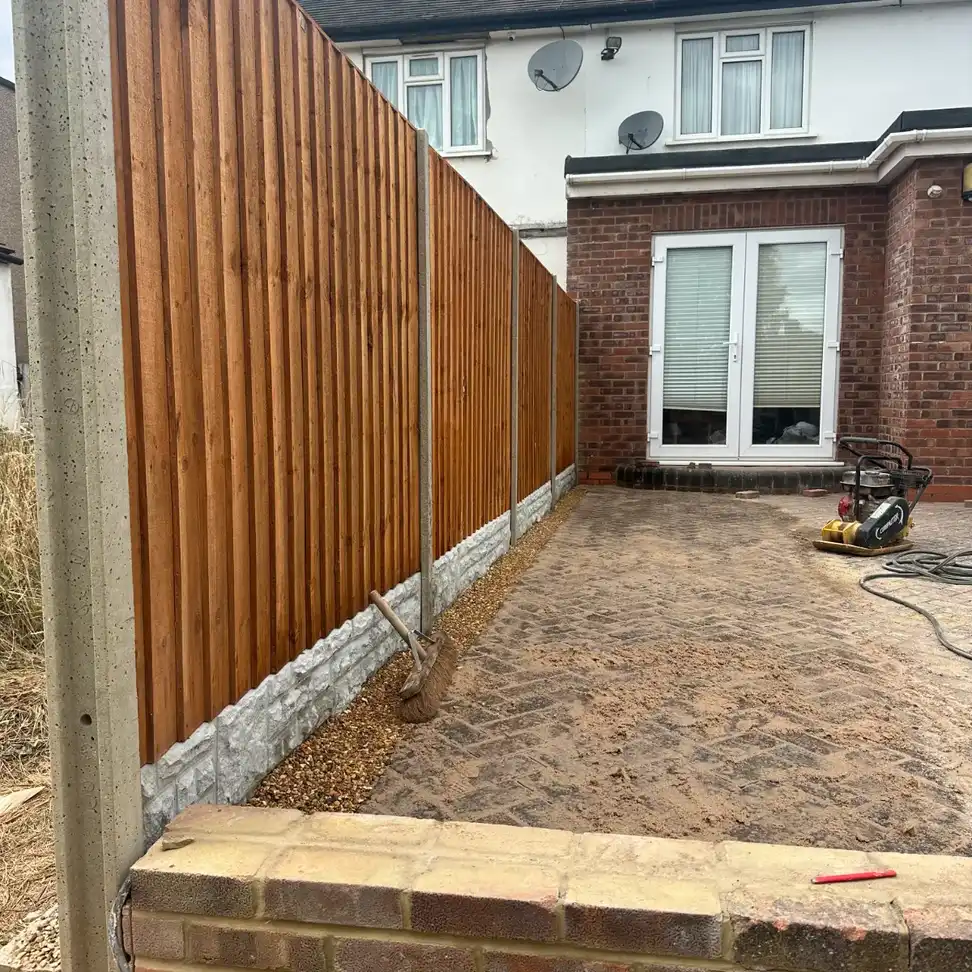 Garden area being prepared beside fencing